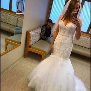 Brand new unaltered wedding dress. Size 8